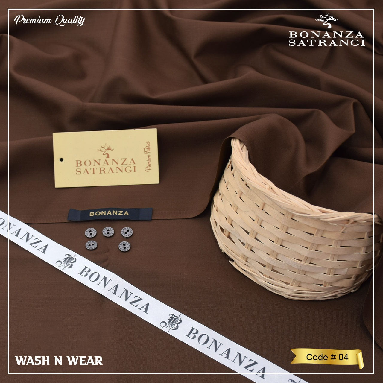 Brown fabric with Bonanza Satrangi branding, buttons, a basket, and a ribbon on a brown background.
