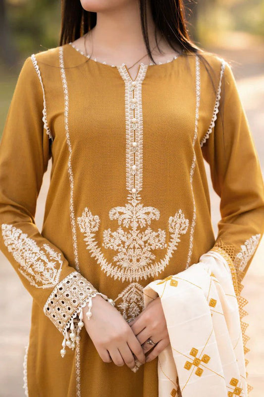 Mustard yellow kurta with white embroidery and a matching dupatta held by a person.